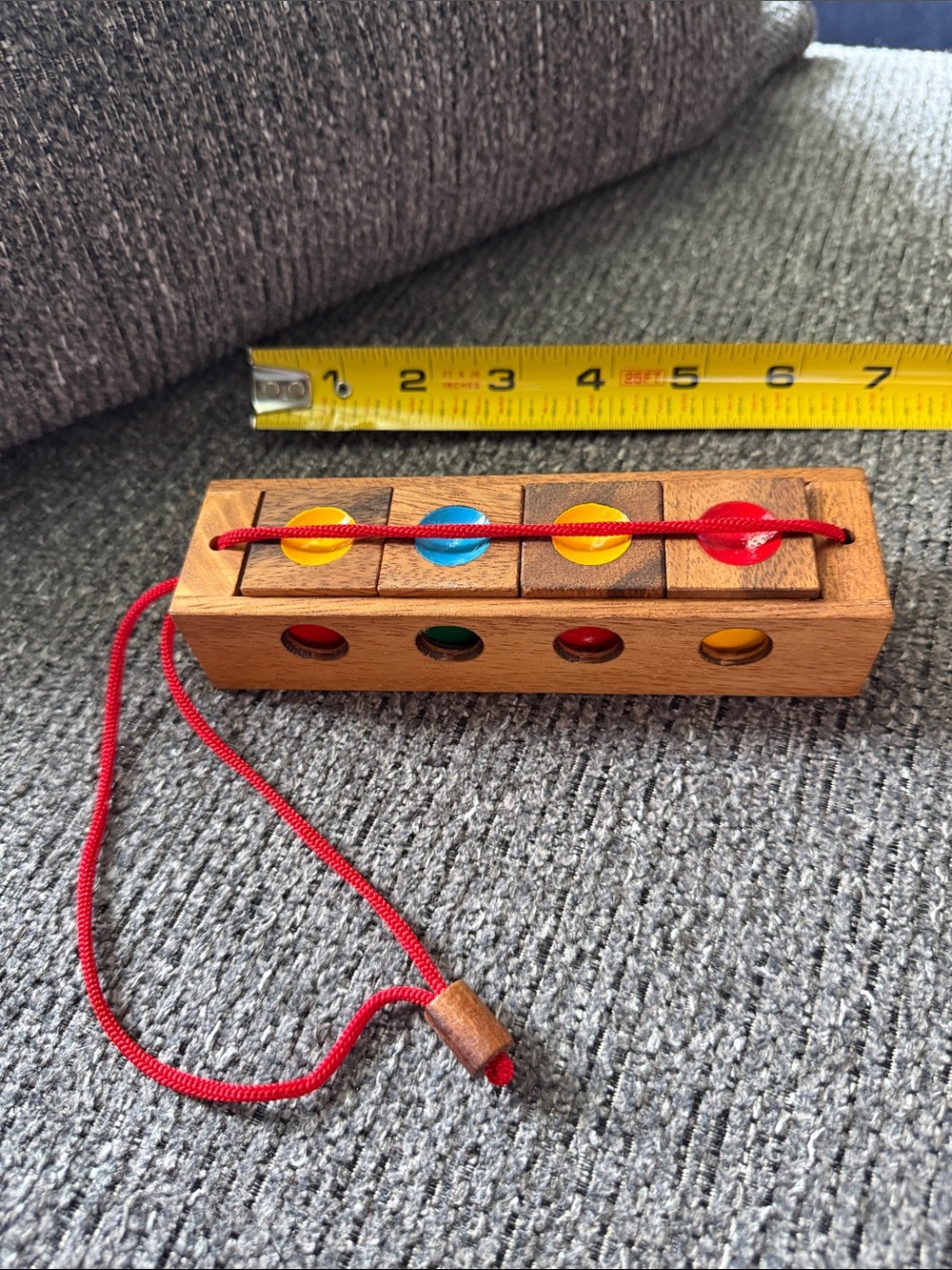 Wooden Color Match Brain Bender Toy with Red Cord